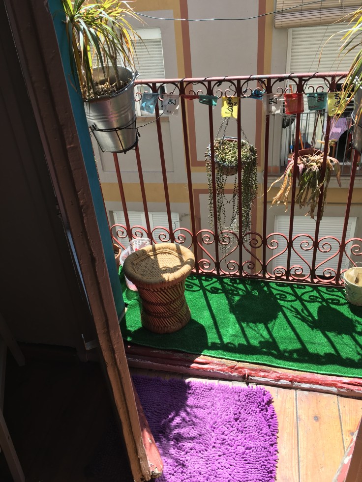 Small balcony in Barcelona with pot plants